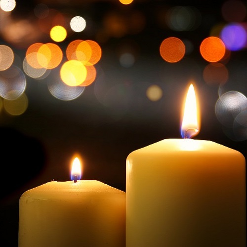 Burning,Candles,Over,Black,Background,With,Bokeh,Glitter,Lights.